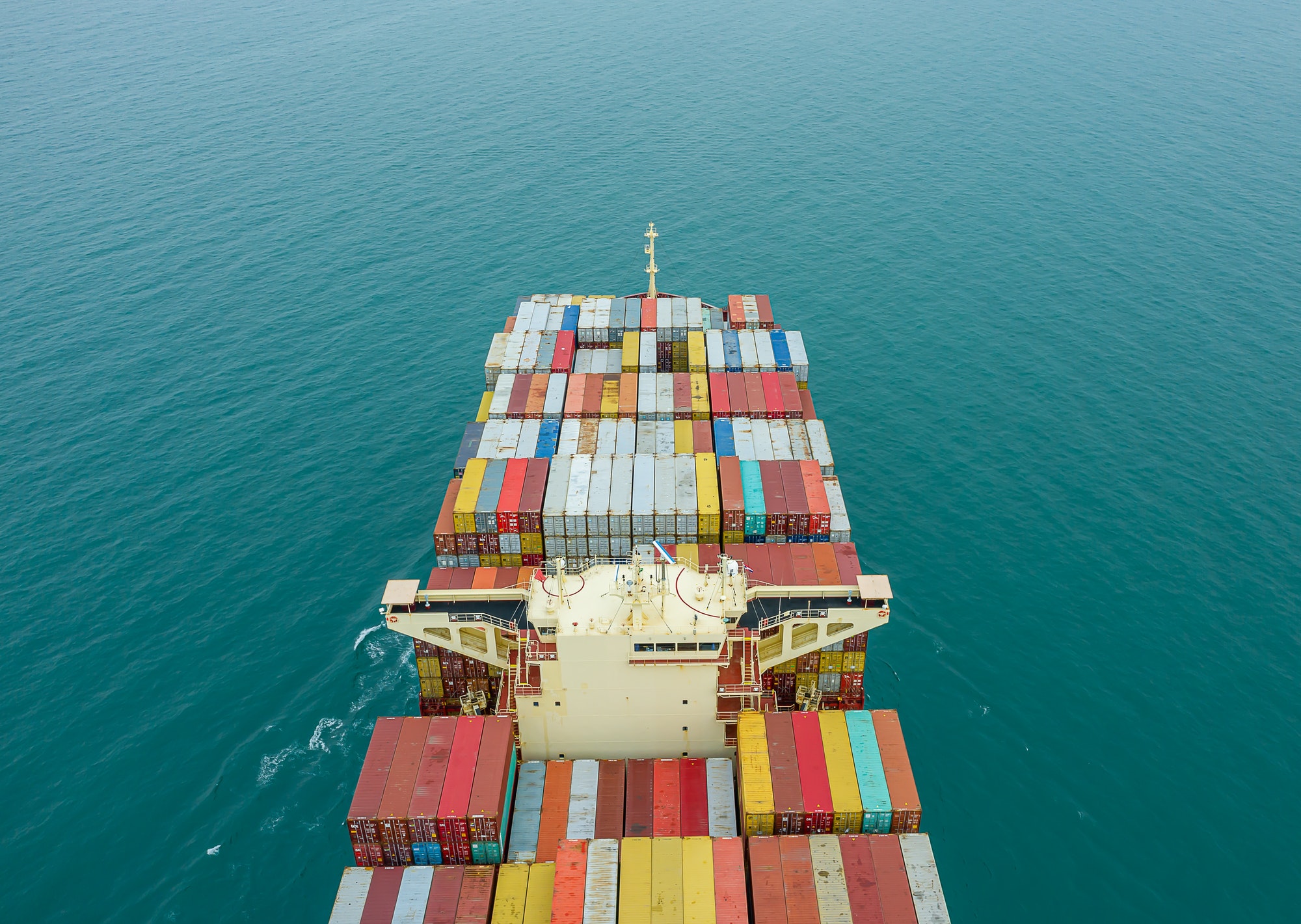 aerial-top-view-of-cargo-ship-carrying-container-for-import-export-goods-to-customer.jpg